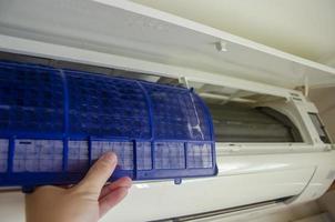 Clean the air conditioner filter from dust in the room, prevent respiratory diseases or allergies. photo