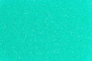 Turquoise color foam sponge porous texture background. Extreme close-up view of detail abstract synthetic material. Horizontal composition photo