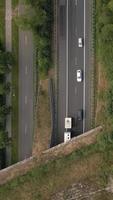 Aerial view of parallel highway roads in a grassy landscape video