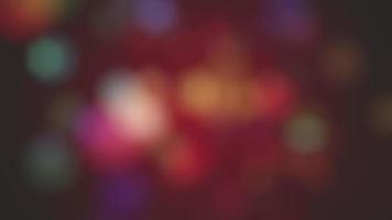 suavemente comovente multicolorido festivo bokeh luz partículas movimento fundo animação. cheio hd e uma desatado laço. video