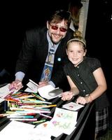 Judd Nelson  Kiernan Shipka of Mad Mencreating a card for A Rose of Thanks who sends thank you cards to troopsGBK Gifting SuiteThompson HotelBeverly Hills CAJanuary 11 20082008 photo