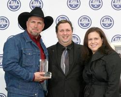 Garth Brooks Bob Romero Exec Dir of ACM and Brooke Primero ACMRIAA Special Recognition Presentation on his 123 Million Recordings SoldGarth Brooks WOF Star outside of Capitol RecordsLos Angeles CANovember 5 20072007 photo