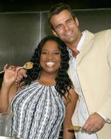 Sherri Shepherd and Cameron Mathison in the Wolfgang Puck Catering kitchen demonstrating and trying the deserts for the Daytime Emmy dinner adjacent to the Kodak Theater piror to Daytime Emmys at the Kodak Theater in Hollywood, CA June 19, 2008 photo