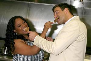 Sherri Shepherd and Cameron Mathison in the Wolfgang Puck Catering kitchen demonstrating and trying the deserts for the Daytime Emmy dinner adjacent to the Kodak Theater piror to Daytime Emmys at the Kodak Theater in Hollywood, CA June 19, 2008 photo