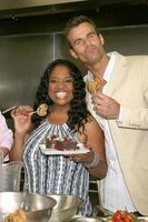 Sherri Shepherd and Cameron Mathison in the Wolfgang Puck Catering kitchen demonstrating and trying the deserts for the Daytime Emmy dinner adjacent to the Kodak Theater piror to Daytime Emmys at the Kodak Theater in Hollywood, CA June 19, 2008 photo