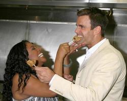 Sherri Shepherd and Cameron Mathison in the Wolfgang Puck Catering kitchen demonstrating and trying the deserts for the Daytime Emmy dinner adjacent to the Kodak Theater piror to Daytime Emmys at the Kodak Theater in Hollywood, CA June 19, 2008 photo