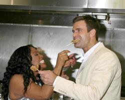 Sherri Shepherd and Cameron Mathison in the Wolfgang Puck Catering kitchen demonstrating and trying the deserts for the Daytime Emmy dinner adjacent to the Kodak Theater piror to Daytime Emmys at the Kodak Theater in Hollywood, CA June 19, 2008 photo