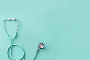 Top view of stethoscope on color  background with empty copy space, flat design. Health medical concept. photo