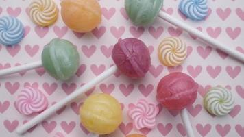 Colored  candies,  mix of sweets and lollipops rotating. video