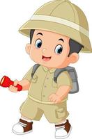 a brave adventurous boy walks and smiles while carrying a flashlight vector