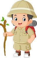 an adventurous boy walks with a backpack and a wooden stick vector