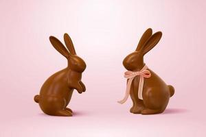 Pascua de Resurrección chocolate conejos, uno con cinta arco y uno sin. 3d fiesta elementos aislado en rosado antecedentes.