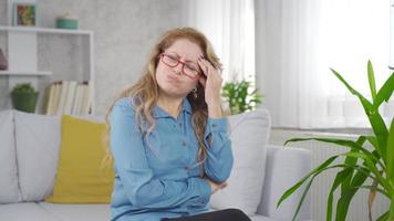 Mature woman has a headache. Sick mature woman has a headache and rubs her head with her hands. video