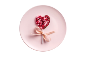 Pink plate and heart lollipop isolated on a transparent background png