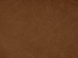 Brown color velvet fabric texture used as background. Empty brown fabric background of soft and smooth textile material. There is space for text. photo