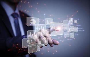 businessman working with business Analytics and Data Management System on computer, online document management and metrics connected to database. Corporate strategy for finance, operations, sales. photo