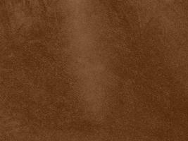 Brown color velvet fabric texture used as background. Empty brown fabric background of soft and smooth textile material. There is space for text. photo
