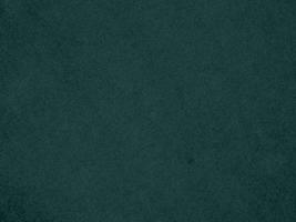 Dark green velvet fabric texture used as background. Empty green fabric background of soft and smooth textile material. There is space for text. photo
