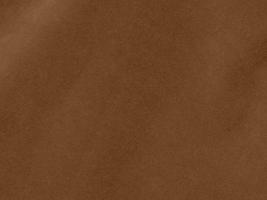 Brown color velvet fabric texture used as background. Empty brown fabric background of soft and smooth textile material. There is space for text. photo