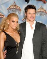 Jessica Simpson and Nick Lacheyarriving  at the MTV Movie Awards at the Shrine Auditorium Los Angeles CAJune 4 20052005 photo