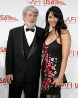 George Lucas and guestAFI Gala In Honor of George LucasLos Angeles CAJune 9 20052005 photo