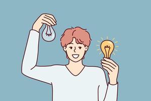 Man holding working and broken light bulbs to show off self-made electricity repair. Light bulbs as metaphor for search for new ideas and independent brainstorming for development of intelligence vector