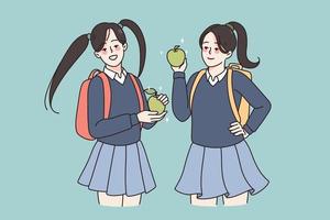 Smiling girls pupils in school uniform and backpacks having lunch eating apple. Happy female students enjoy break in college or university. Education and learning concept. Flat vector illustration.