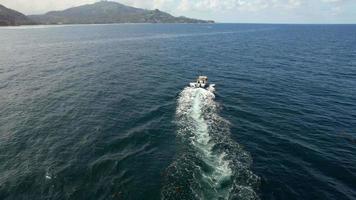 Drone shot folowing fishing boat at sea Mahe Seychelles video