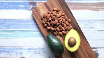 Top view of almond and avocado on chopping board video