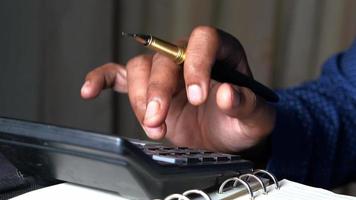 Close up of man hand using calculator video