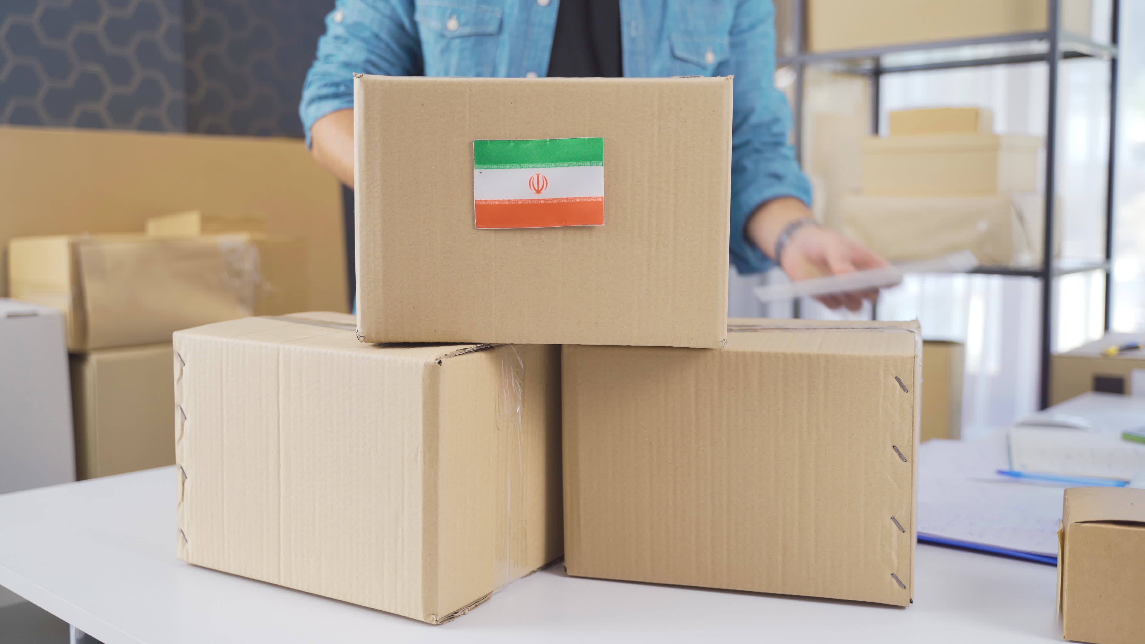 Iran flag on logistic cargo package. Cargo package with Iran flag