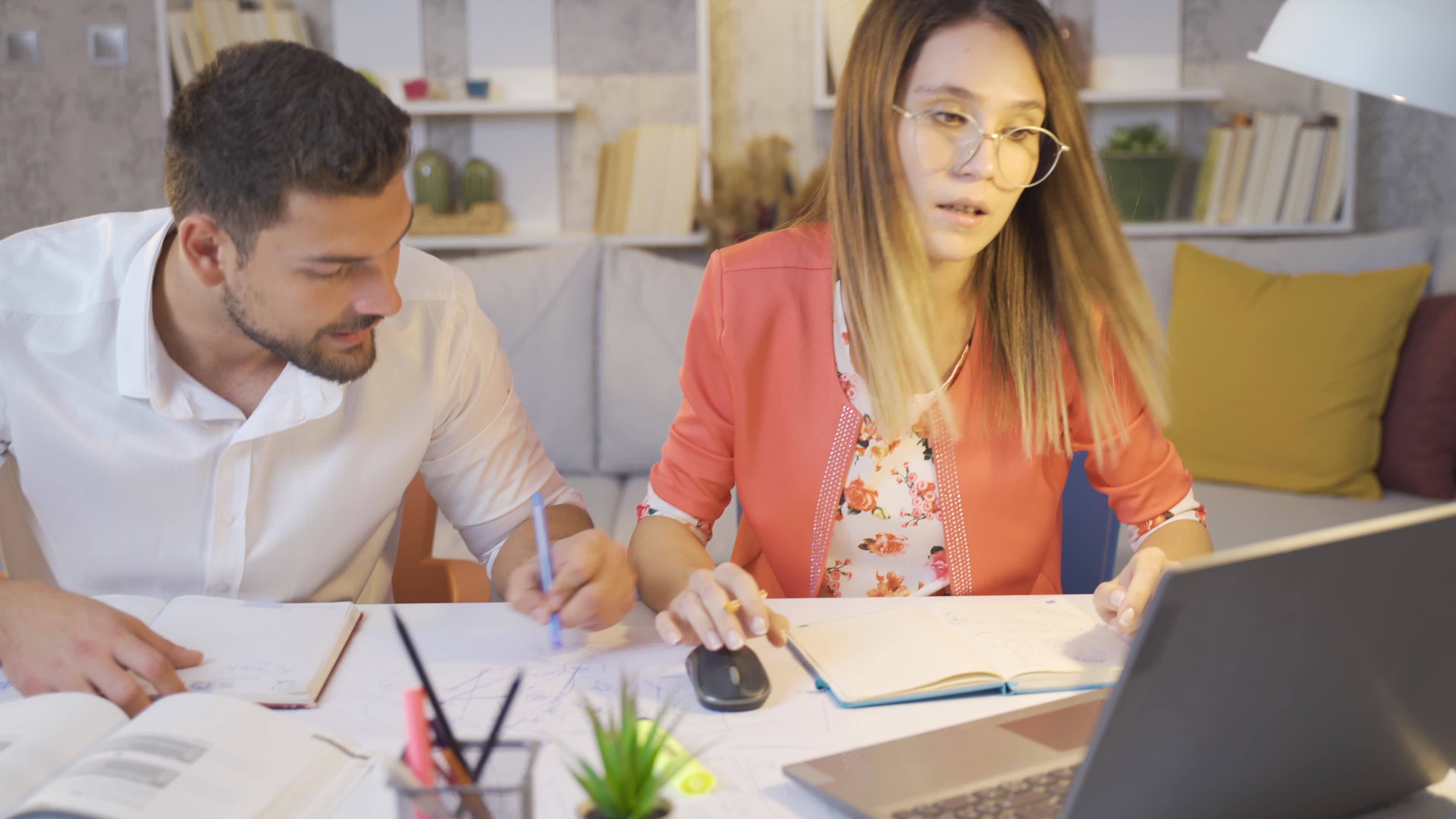 Architect couple working in home office prepare and discuss drawing