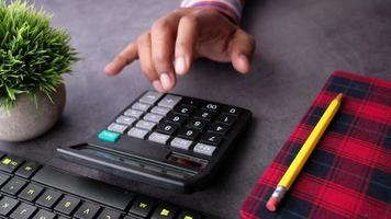 Close up of man hand using calculator video