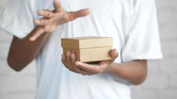 Top view of person open a empty small gift box video