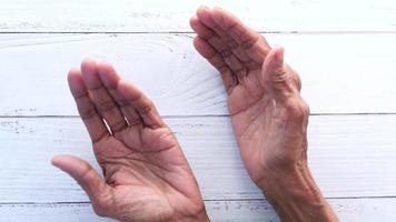 Muslim man keep hand in praying gestures during ramadan, Close up video