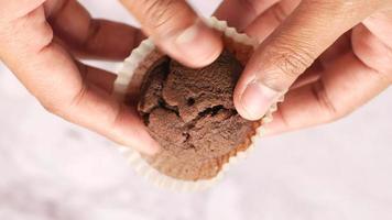 Top view of man hand taking chocolate pancake from table video