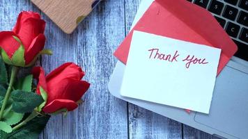 Thank you message and envelope on wooden table video