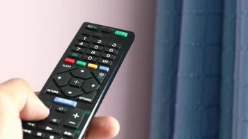 close up of man hand holding tv remote video