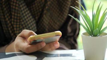 Close up of woman hand holding smart phone video