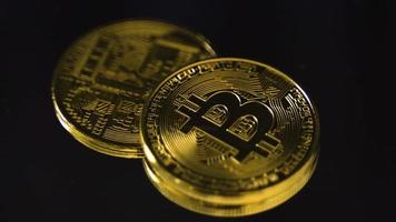 Shining golden bitcoins. Bitcoins are glowing. Financial investment advice. video