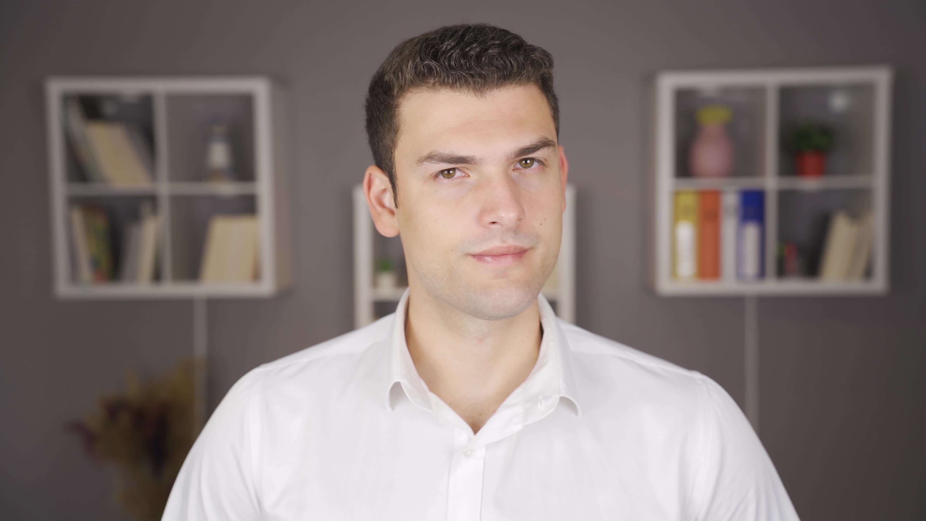 Rejecting Man Indoors Shaking His Head.Negative. Shaking his head, the