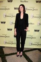 Anne Hathaway arriving at the Women In Film 2nd Annual PreOscar Cocktail Party at the home of Peter  Tara Guber in Bel Air CA onFebruary 20 20092009 photo