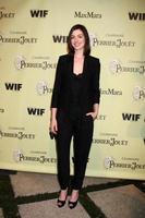 Anne Hathaway arriving at the Women In Film 2nd Annual PreOscar Cocktail Party at the home of Peter  Tara Guber in Bel Air CA onFebruary 20 20092009 photo