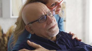 Old couple. They are happy and hugging. Happy marriage. Elderly couple hugging and cheering each other up. video