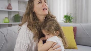 Sad girl in her mother's arms. Sad girl in her mother's arms is unhappy. video
