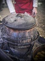 Serbian traditional stew cooked in big pots photo