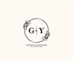 initial GY letters hand drawn feminine and floral botanical logo suitable for spa salon skin hair beauty boutique and cosmetic company. vector