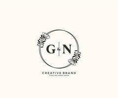 initial GN letters hand drawn feminine and floral botanical logo suitable for spa salon skin hair beauty boutique and cosmetic company. vector