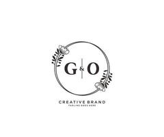 initial GO letters hand drawn feminine and floral botanical logo suitable for spa salon skin hair beauty boutique and cosmetic company. vector