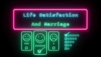 liv tillfredsställelse och äktenskap neon grön blå fluorescerande text animering rosa ram på svart bakgrund video